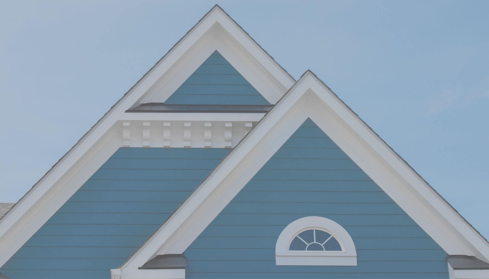 A white and blue siding installation service in Columbus, Ohio